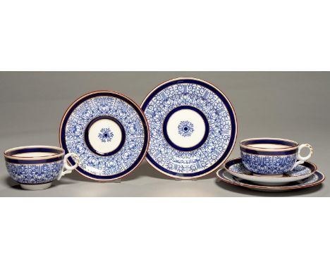 A PAIR OF ROYAL WORCESTER ROYAL LILY PATTERN BREAKFAST CUPS, SAUCERS AND PLATES, 1890 AND 1905, PLATE 19.5CM DIAM, PRINTED MA