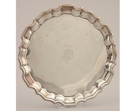 A VICTORIAN SILVER WAITER, ON THREE LEAF CAPPED VOLUTE SCROLL FEET, 16CM DIAM, BY THOMAS BRADBURY & SONS, LONDON 1890, 5OZS 1