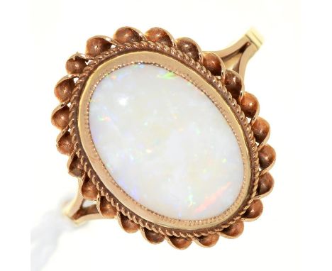 AN OPAL RING, IN 9CT GOLD, 3.3G, SIZE L½ Condition report  &nbsp;The opal of good polish, marks obscured by dirt