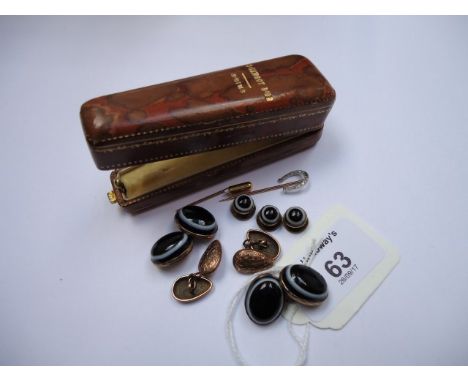 A pair of 9ct gold ovoid cufflinks, foliate engraved, a pair of banded agate cufflinks with three matching studs and a diamon