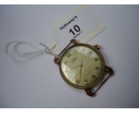 A gentleman's 9ct gold wristwatch, champagne dial, Arabic numerals, sweep seconds hand, and lobed lugs, the dial and movement