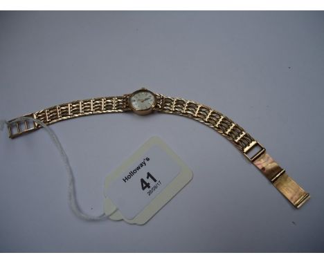 A lady's 9ct gold Rotary wristwatch, the oval dial with baton numerals and integral gate link bracelet