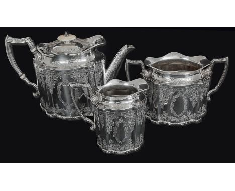 A Victorian three piece silver teaset, of panelled oval form, foliate engraved to body, with gadrooned borders and 'D' shaped