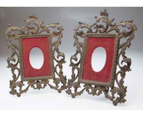 A pair of 19th century cast gilt metal portrait miniature frames, each with scrolling pierced acanthus leaves around a red pl