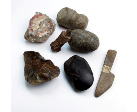 A collection of archaeological finds, to include knapping stone, flint axe heads, mosaic fragment, neolithic tools and simila