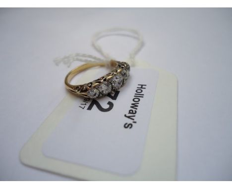 A graduated five stone half hoop ring, the old brilliant cut diamonds claw mounted, with rose diamond detail, to scroll pierc