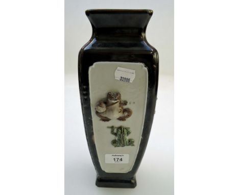 A late 19th century Japanese square section vase, of tapering form, the panelled sides decorated in relief with frogs playing