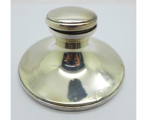 A silver capstan inkwell 