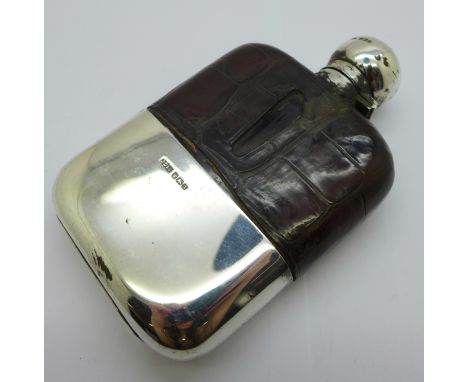 A silver, glass and leather mounted spirit flask, weight of cup 74g 