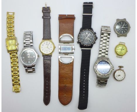 A collection of lady's and gentleman's wristwatches including Timex, Lorus, a small trench style watch, lacking button, and f