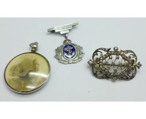 A silver and enamel Naval drop brooch, a white metal set paste brooch, c.1900, and an Edward VII hallmarked silver double sid