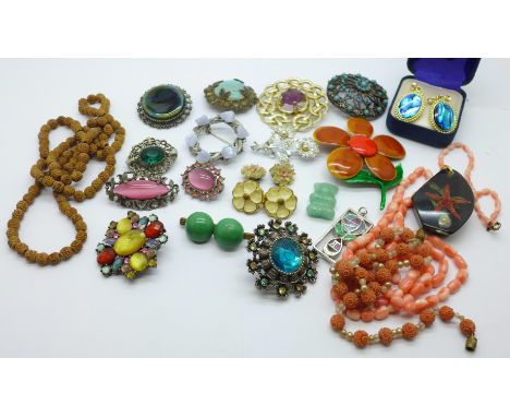 A carved coral bead and pearl necklace, a coral necklace, lucite pendant, brooches, etc. 