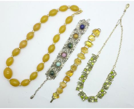 A citrine set bracelet, a Celtic bracelet, a paste set necklace and a Bakelite necklace 