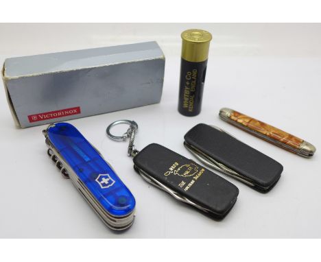 A Victorinox multi-tool pocket knife, with box and four others 