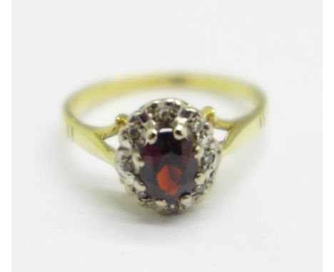 An 18ct gold, garnet and diamond cluster ring, 3.4g, O 