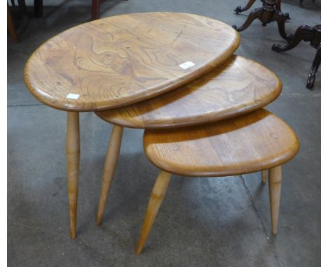 An Ercol pebble shaped nest of tables