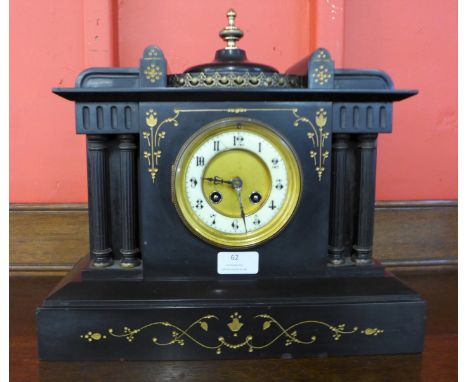 A 19th Century French Belge noir mantel clock, the movement stamped Medaille D' Argent