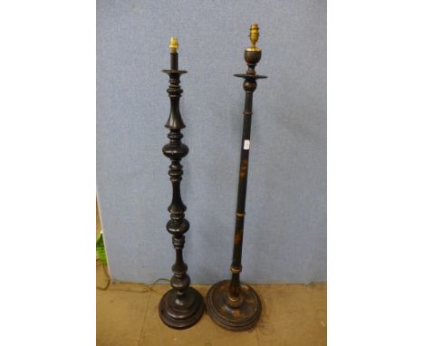 A black Japanned standard lamp and an ebonised standard lamp