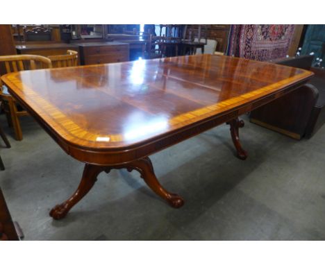 A Chippendale Revival mahogany and satinwood crossbanded pedestal dining table