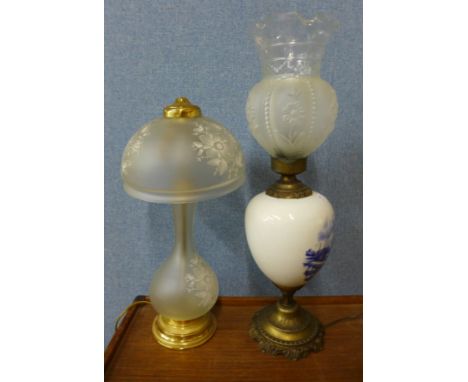 A blue and white porcelain table lamp and a frosted glass table lamp