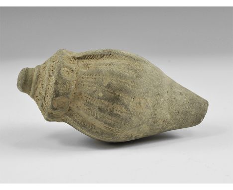 9th-11th century AD. A hollow ceramic vessel decorated with thick conical nozzle; to the shoulders and body lozengiform lugs 