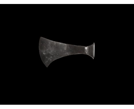 9th-11th century AD. An iron axehead with expanding blade, curved edge, rounded back with slightly flared profile. Property o