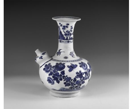 Kangxi Period, Late 17th century AD. A blue and white glazed ceramic kendi wine pitcher with chrysanthemums, blossom and butt