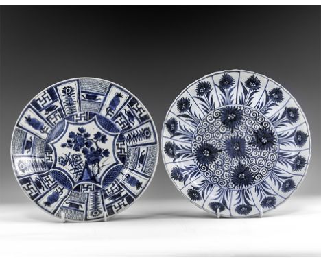 Kangxi Period, Late 17th century AD. A pair of blue and white glazed ceramic dishes, one a lotus dish with chrysanthemum moti