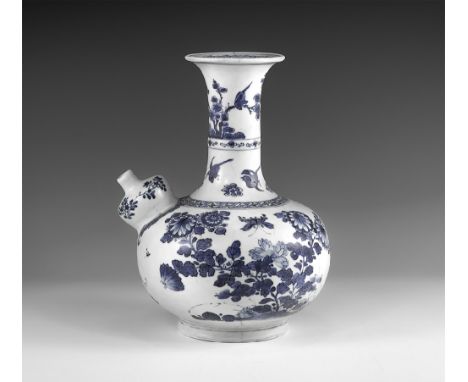 Kangxi Period, Late 17th century AD. A blue and white glazed ceramic kendi wine pitcher with chrysanthemums, blossom and butt