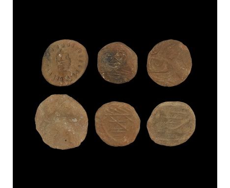 6th-8th century AD. A group of six conical ceramic stamps, each with a mask or geometric design to the underside. Property of