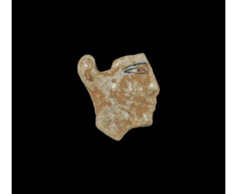 Roman Period, 30 BC-323 AD. A moulded white glass inlay panel with pink pigment, profile male bust with blue outline to the b