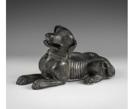 Kangxi Period, Late 17th century AD. A hollow-formed pewter-grey glazed ceramic dog figurine with open mouth, green-glazed co