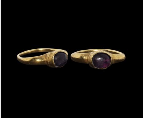 15th century AD. A D-section facetted hoop with expanding shoulders, cupped bezel with inset cabochon amethyst. Property of a