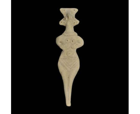 12th-8th century BC. A ceramic idol figurine with lozengiform lower body rising to flat-section upper body, depicting a stand