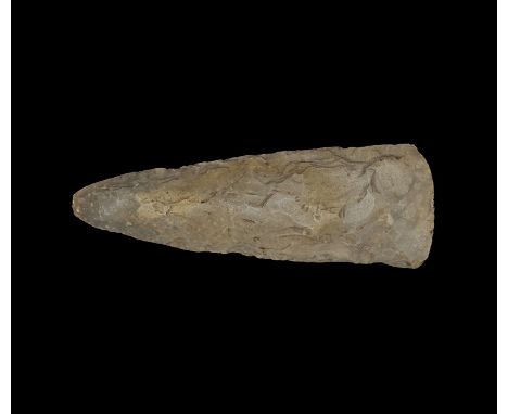 Neolithic, 5th-3rd millennium BC. A bifacial axe with polishing to the convex cutting edge, tapering evenly to a sharply roun