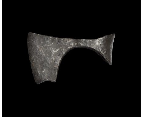 9th-11th century AD. An iron axehead with triangular-section blade widening to a broad bevelled edge with square chin and spu