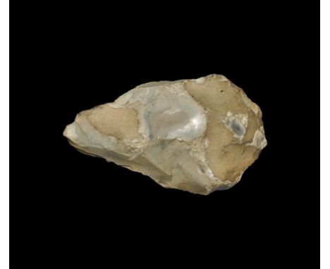 Palaeolithic, 400,000-300,000 BP. A massive piriform bifacial flint hand-axe with cream-coloured cortex, flattened hand edge 