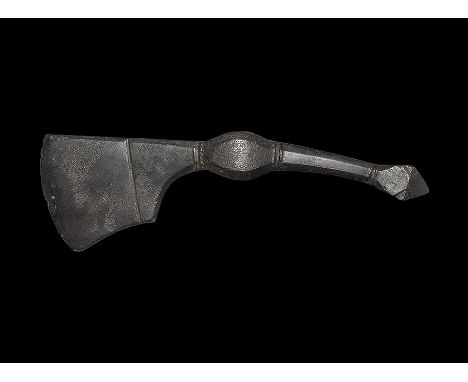 11th-12th century AD. A hand-forged iron axehead with square chin and ribbing to the short blade, chamfered edges to the sock