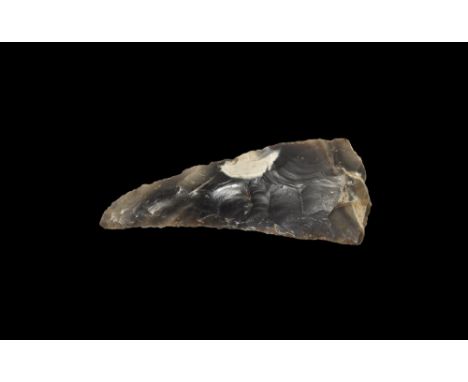 Neolithic, 3rd-2nd millennium BC. A triangular bifacial knapped flint sickle of large size from a substantial flake with slig