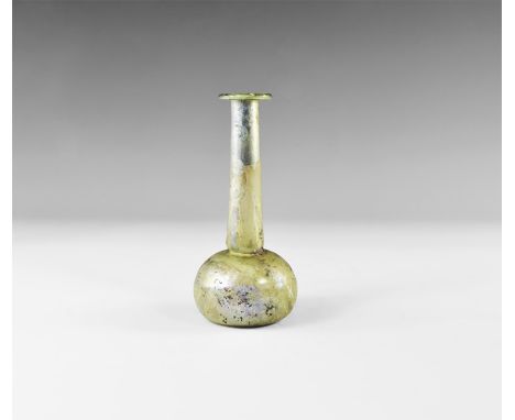 1st-2nd century AD. A pale blue iridescent glass flask with bulbous body, tapering neck and returned rim. Private collection,