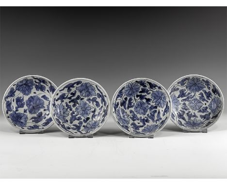 Kangxi Period, Late 17th century AD. A group of four blue and white glazed ceramic dishes with floral decoration. From the 'B