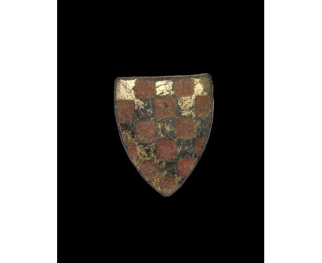 13th-14th century AD. A heater-shaped plaque with stud to the reverse, gilt surface with square enamel-filled recesses, blazo