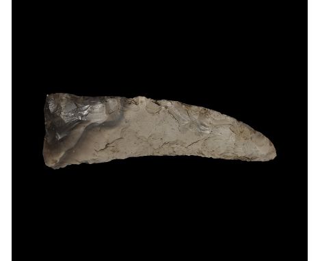 Neolithic, 5th-3rd millennium BC. A fully bifacial knapped and large sickle knife of crescentic shape with concave cutting ed