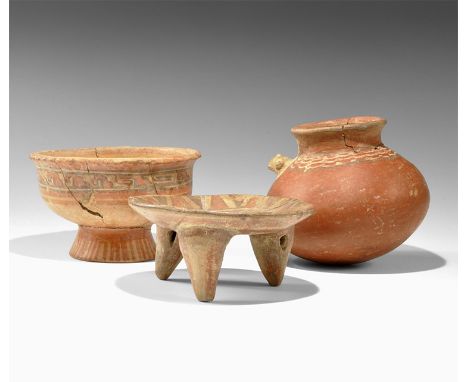 1st millennium AD. A mixed group comprising: a Cajamarca tripod bowl with geometric designs; a polychrome footed bowl; a red 