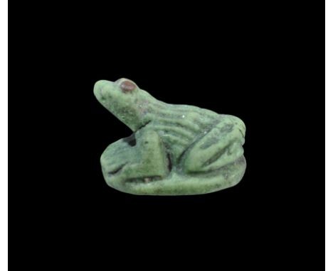 New Kingdom, 1550-1070 BC. A green glazed composition frog amulet with hieroglyph to the underside. Property of a London gent