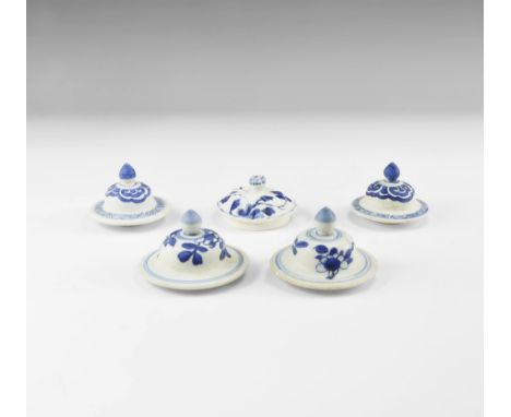 Kangxi Period, Late 17th century AD. A group of blue and white glazed ceramic bell-shaped lids with floral and cloud ornament