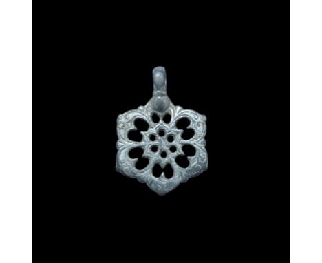 15th century AD. A silver hexagonal plaque with integral loop, openwork floral detailing. From a Surrey, UK, collection; form