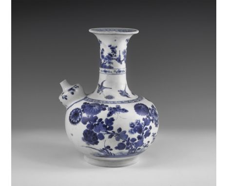 Kangxi Period, Late 17th century AD. A blue and white glazed ceramic kendi wine pitcher with chrysanthemums, blossom and butt