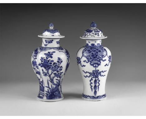 Kangxi Period, Late 17th century AD. A pair of blue and white glazed ceramic meiping vases, each with bell-shaped lid and kno