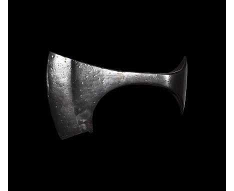 9th-11th century AD. An iron axehead with triangular-section blade widening to a broad bevelled edge with square chin and spu